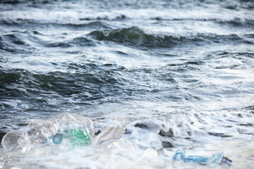 Environmental pollution. Sea beach with plastic garbage