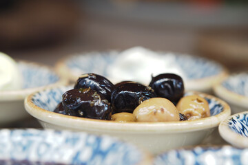 Mediterranean olives served in small bowls at a market