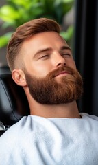 Fototapeta premium Relaxed Young Man with Stylish Beard Enjoying Barber Experience in Modern Salon Setting