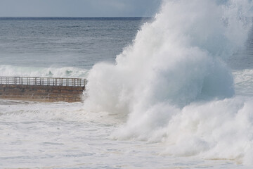 king tide waves crashing on the beach