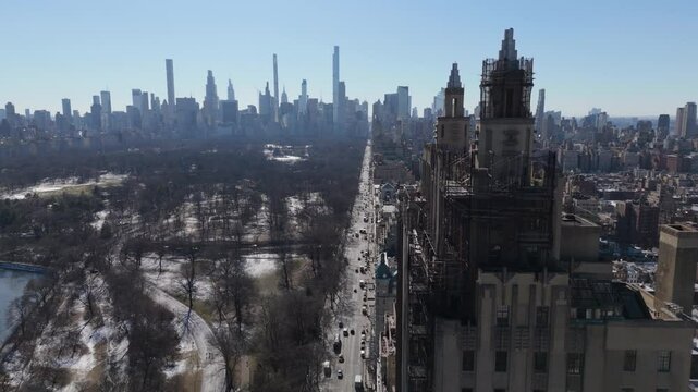 winter flying clockwise around tower on Central Park West in NYC