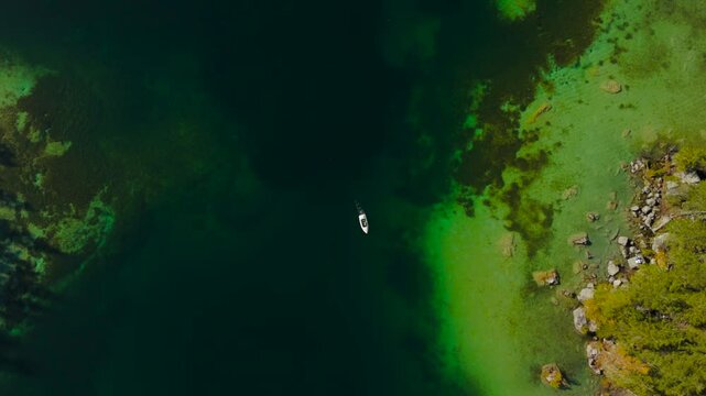 Hintersee in Ramsau, Germany captured from above in autumn, features turquoise waters of Ramsauer Ache, majestic Alps and Magic Forest. Enjoy boat rentals on this tranquil lake perfect for relaxation