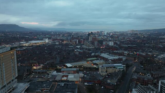 Aerial view of Residential homes and Business in Belfast City Skyline Cityscape Northern Ireland by night black background at night 27-01-25