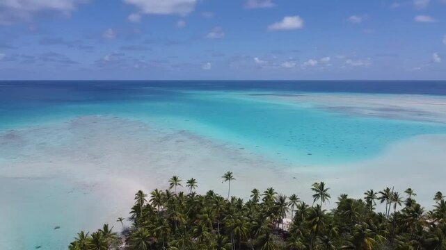 Aerial view of a serene lagoon in French Polynesia, blending vivid turquoise, light blue, and pristine white sand. A tropical paradise perfect for tranquil vacations.