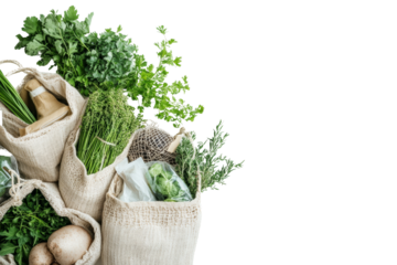 Fresh herbs and vegetables in eco-friendly bags, showcasing a commitment to sustainable living and healthy food choices on a white isolate background.