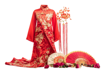 Traditional red silk dress with intricate gold embroidery, adorned with decorative fans and flowers, perfect for cultural celebrations.