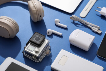 Composition with modern gadgets on blue background