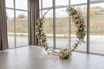 Arch for the wedding ceremony, decorated with white and pink flowers. Wedding day. 