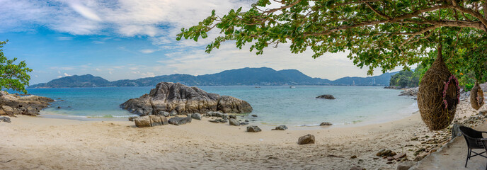 Patong Beach phuket Thailand beautiful turquoise blue waters on the white sand and long tail boats used for tourist 