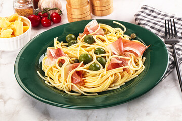 Pasta spaghetti with olives and jamon