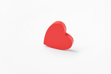 Heart shaped figurine on white background. Valentine's Day celebration