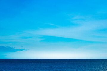 Nature of the beach and sea Summer with sunshine, sandy beaches, clear blue waters sparkling against the blue sky. On an island with good ecology and environment Background for summer vacation