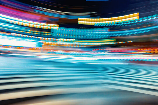 City motion blurred street intersection background at night