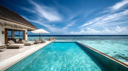 Fototapeta premium Tranquil beachfront pool, modern luxury resort setting with crystal-clear water, bright sky, ideal for relaxation and getaway.