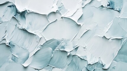 Fototapeta premium Abstract texture of layered paint in soft blue and white tones.