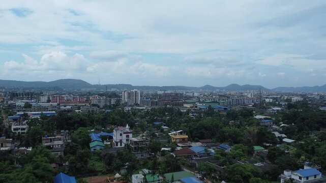 Aerial View of an Expanding Urban Landscape with Hills in the Background