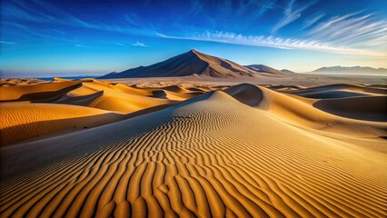 Naklejka premium A vast expanse of shifting sand dunes stretching towards a distant rocky outcropping, shifting sands, arid environment