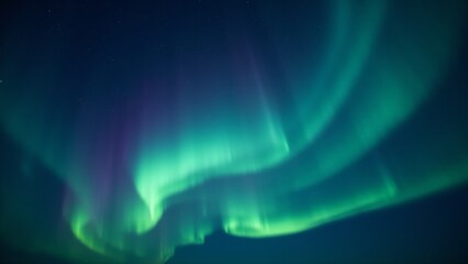 Fototapeta premium A breathtaking night sky filled with auroras borealis in shades of green and violet, illuminating the stars.