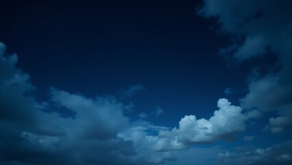 A serene night sky with soft clouds drifting through, letting stars shine brightly between them.