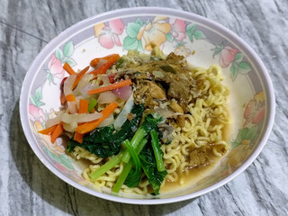 Mie, Mie ayam, mi ayam, or bakmi ayam is a common Indonesian dish consisting of seasoned yellow wheat noodles topped with chicken pieces. This dish originates from Chinese culinary techniques.