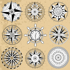 Design vector set with line art old compasses or rose winds with decorative elements, arrows and patterns. Vintage transportation and old adventures concept isolated on white.