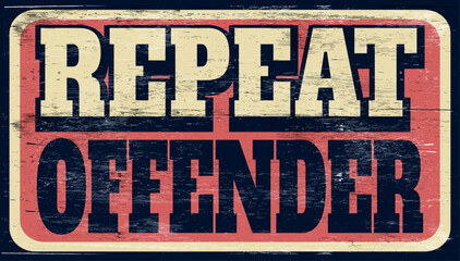 Aged vintage repeat offender sign on wood