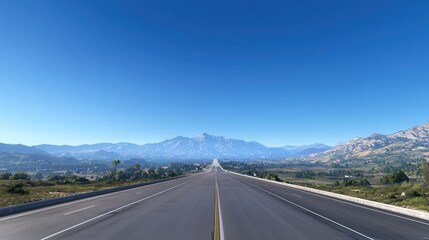 Naklejka premium Long winding road leading through a scenic landscape with a mountain range in the background on a clear day