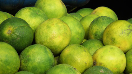 Lemons on display in a street fruit stall