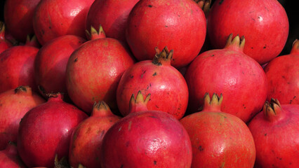 Fresh pomegranate displayed in a fruit stall