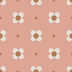Cute little four petal flowers arranged on a dotted background in a dusty color palette of brown and off white on pink background. A seamless vector pattern. Great for home decor, fabric, wallpaper.