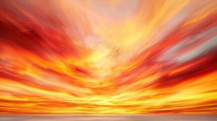 A breathtaking sunset with vibrant hues of orange, red, and yellow blending seamlessly across the sky, creating a serene and dramatic atmosphere.