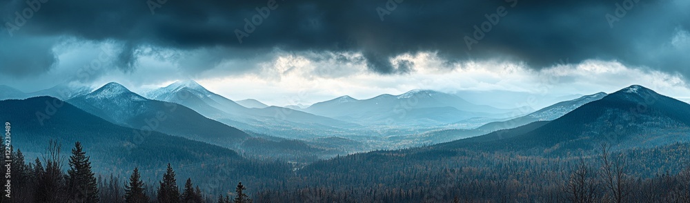 Poster a mountain range with a cloudy sky in the background