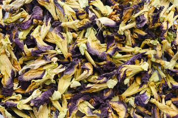 Dried Blue Butterfly Pea flower or Clitoria ternatea for herbal tea. Textured background
