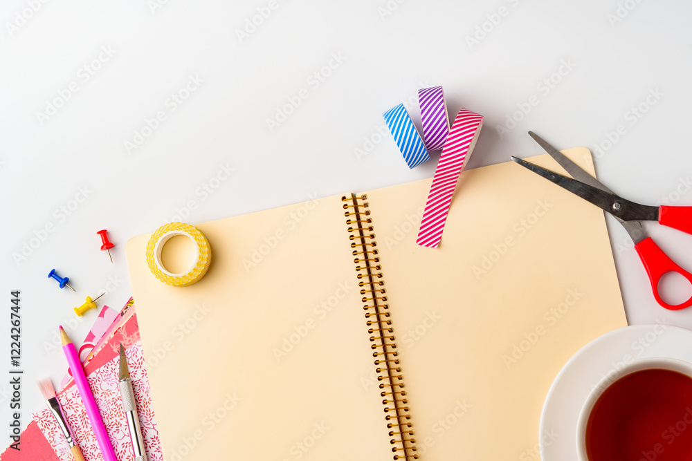 Poster creative workspace setup features colorful supplies and notebook for diy projects in a bright, organ