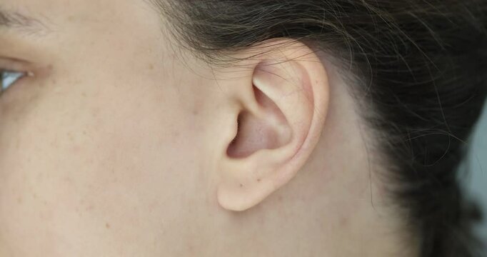 Female human ear and hair concept
