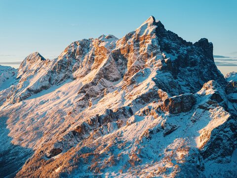 Aerial drone view of snow on the mountains in the Dolomites