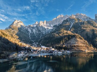Aerial drone view of the Alleghe village, Italy in daylight