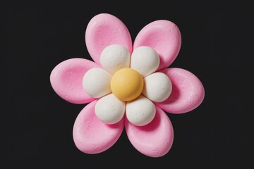 Fototapeta premium A Vivid Pink Flower with a White Center and Yellow Circle Against a Black Background
