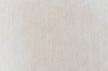 Natural texture: top view of beach sand, clear, clean and smooth. Minimalist background for summer concepts, travel, vacations and outdoor enjoyment.