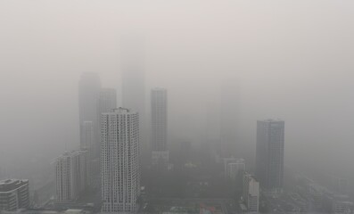 Fototapeta premium Gray Hazy Cityscape High Rise Buildings in Thick Fog