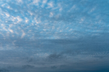 Blue Sky with Fluffy White Clouds on a Sunny Summer Day
