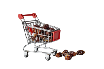 A tiny shopping cart filled with dates sits beside scattered fruits on a clean white surface, showcasing a unique culinary delight isolated on transparent background