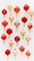 A minimalist composition of multiple Chinese lanterns in various shades of red and gold, arranged symmetrically against a pure white background.