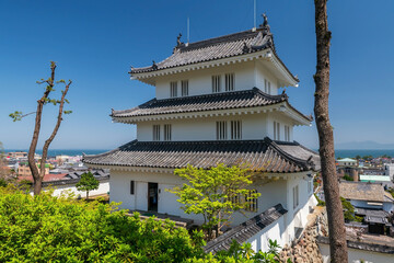 Shimabara castle by city and sea view against blue sky, Nagasaki