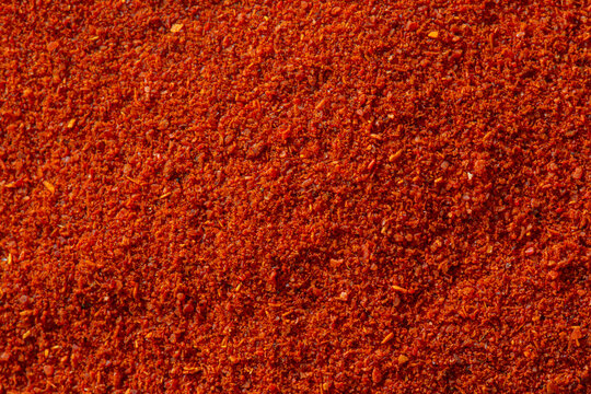 Close-up of ground paprika cooking spice background. Oriental spice cookery food concept.