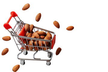 A small shopping cart filled with almonds scattered on a clean white surface, showcasing a playful food shopping moment isolated on transparent background