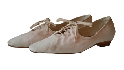 These gentle ballet flats, crafted from soft fabric, rest serenely, highlighting their vintage charm