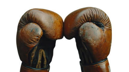 Vintage boxing gloves locked in a classic stance, representing a timeless sport's spirit and rivalry