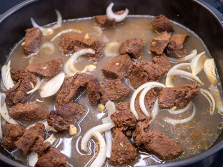 Slow-roasted venison, to which chopped onions are added during roasting.  Deer meat is very rare,...