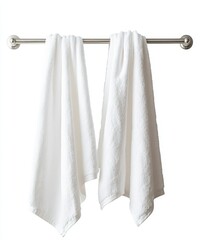 Two white bath towels hanging on a metal bar.